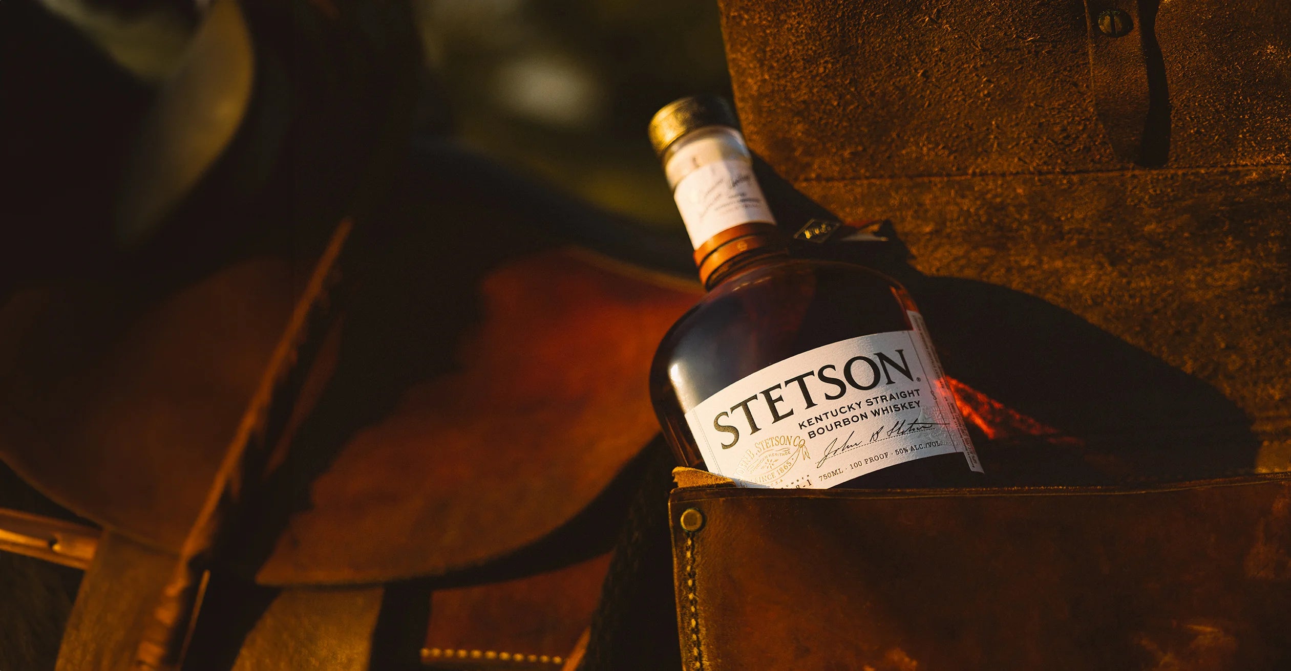 Stetson Bourbon resting on a whiskey barrel